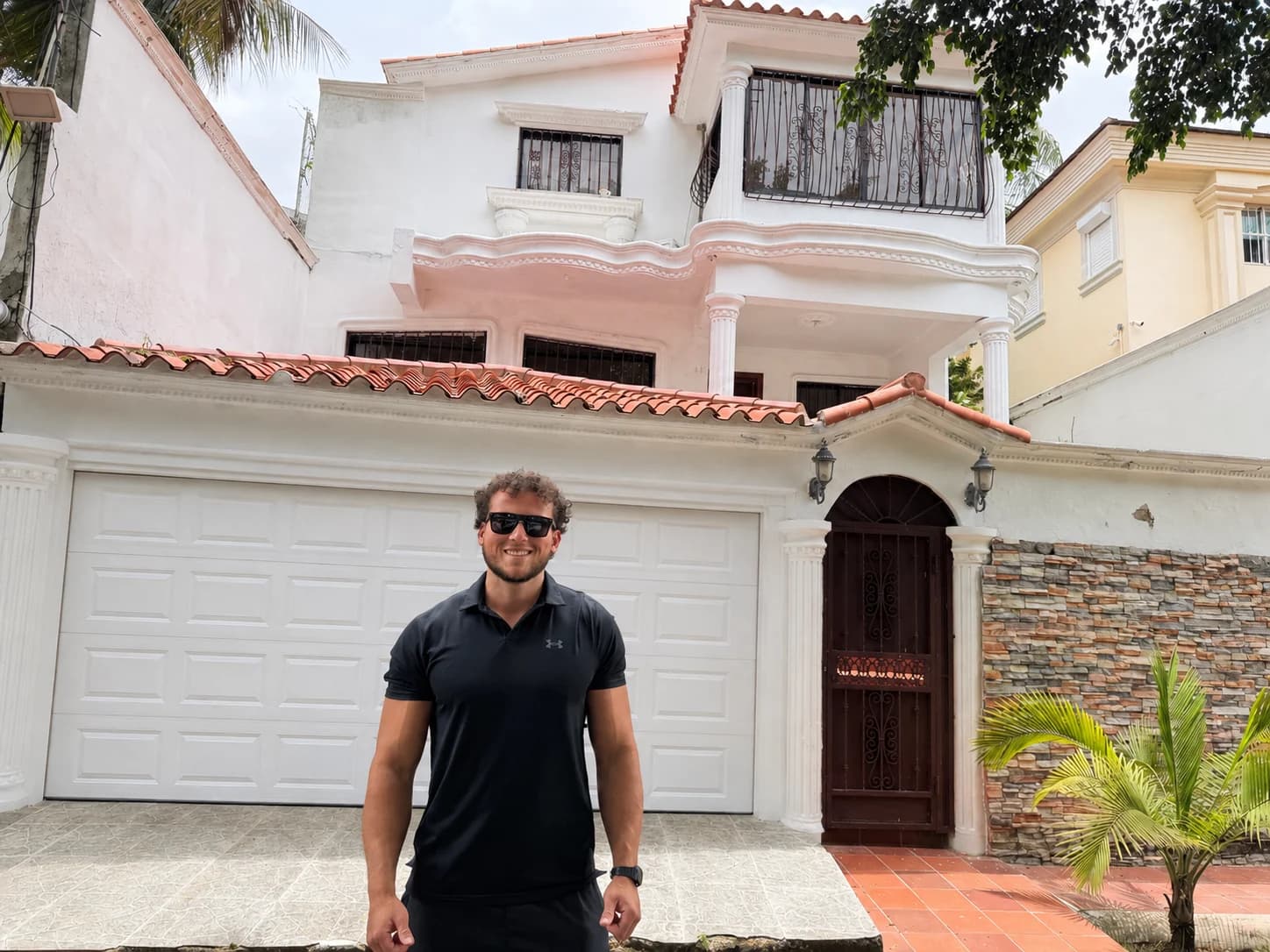 Man standing in front of house in Santo Domingo